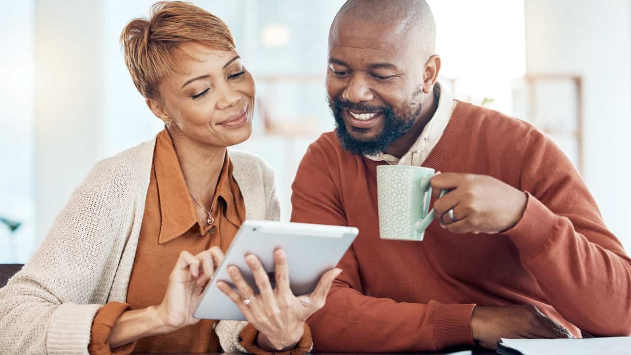 Older couple looking at e-statements.