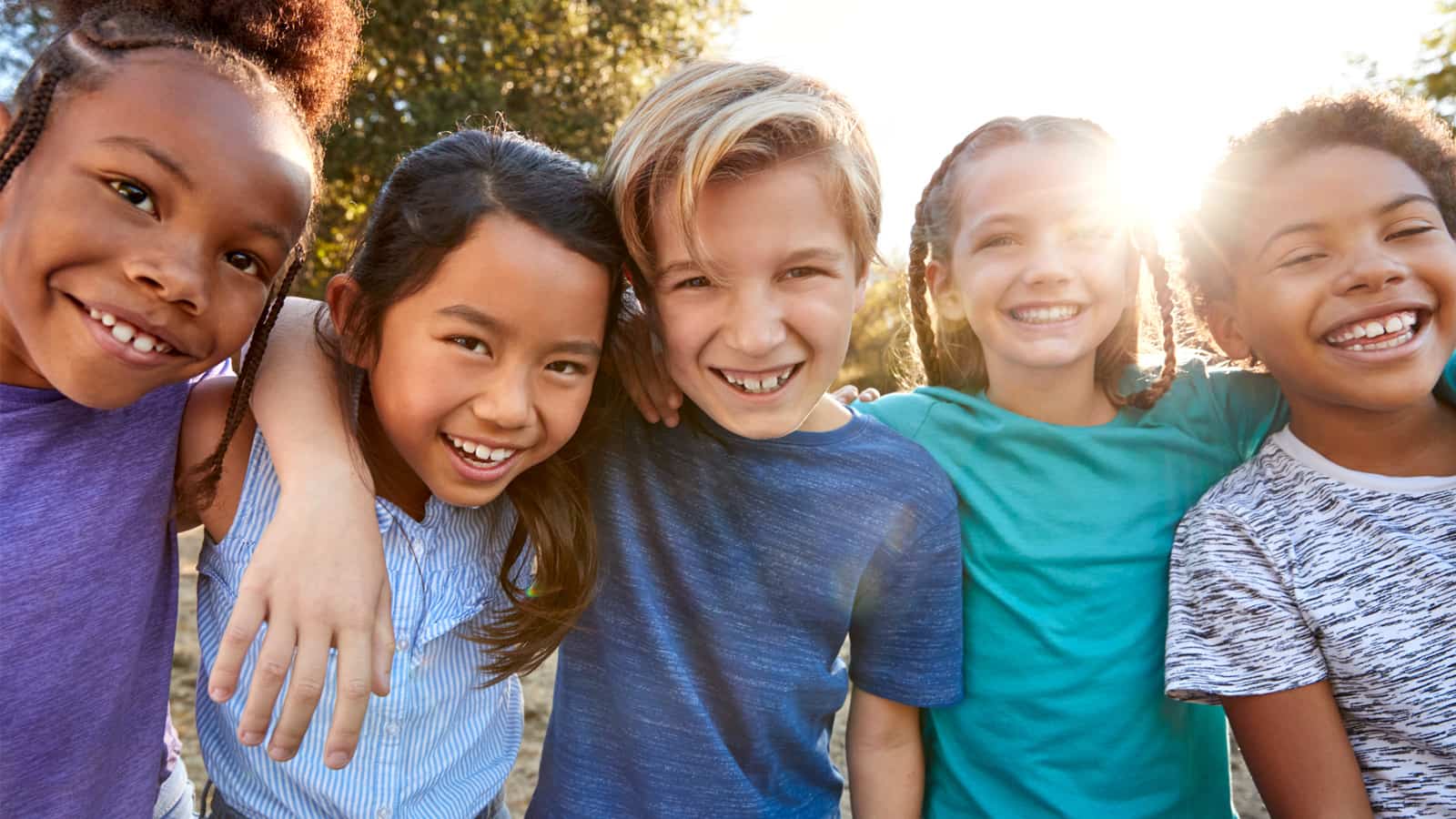 Group of young teens with smiles on their faces