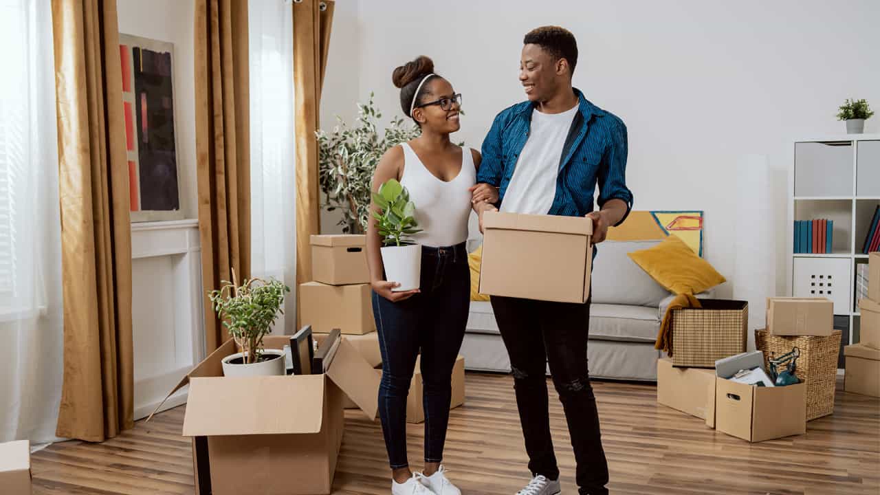 Young couple moving into their first home.