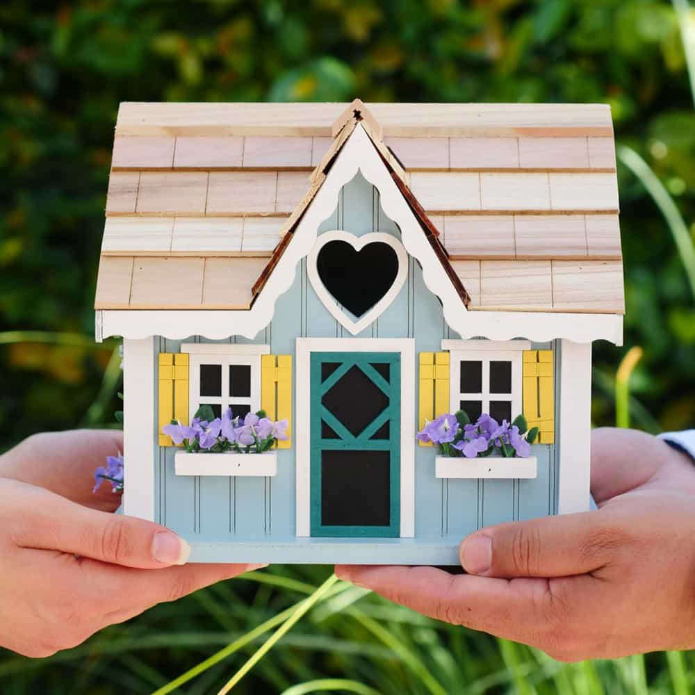 Cute blue house with yellow windows.