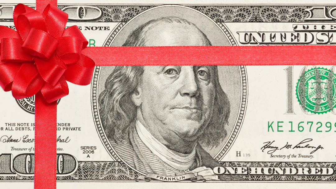 Money with red bow on it.