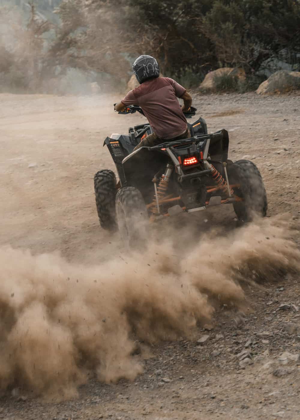 Youg teen enjoying riding an ATV