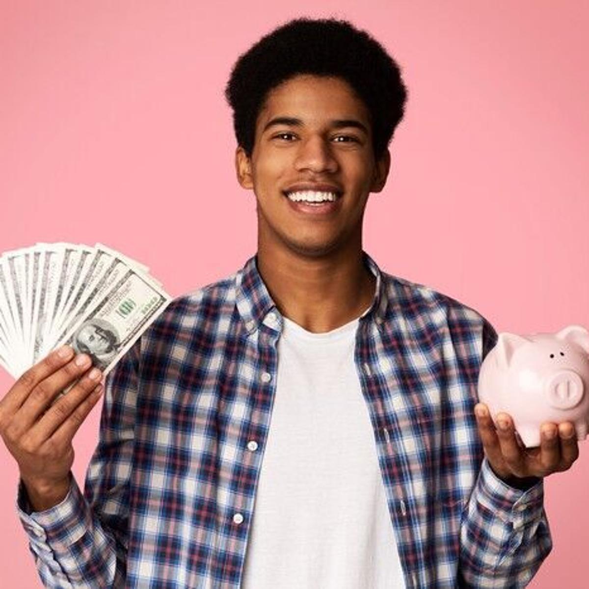 Kid Holding Money and Piggy Bank