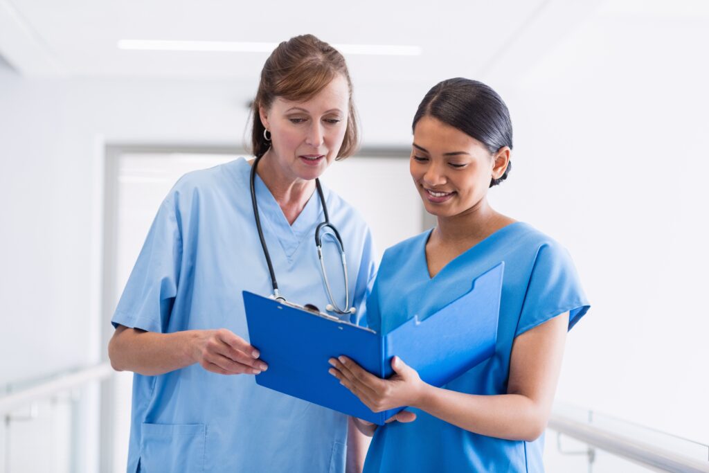 Nurses with clipboard talking