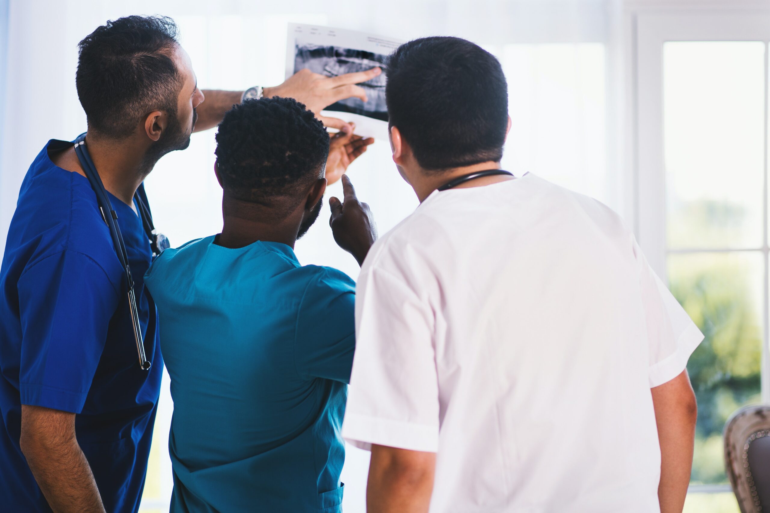 Group of doctors looking at X-ray