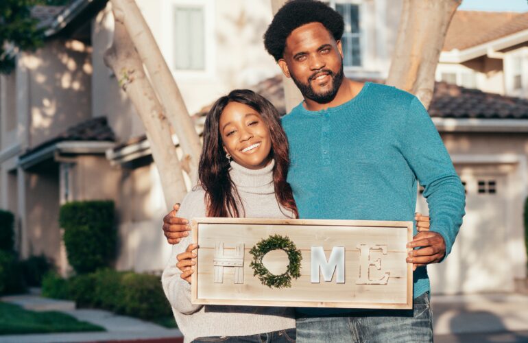 Couple in Front of New Home